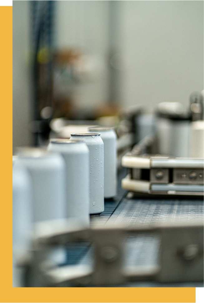 About RG Seamer Service Hero - Photo by Donovan Kelly: https://www.pexels.com/photo/a-conveyor-belt-with-cans-on-it-27623556/